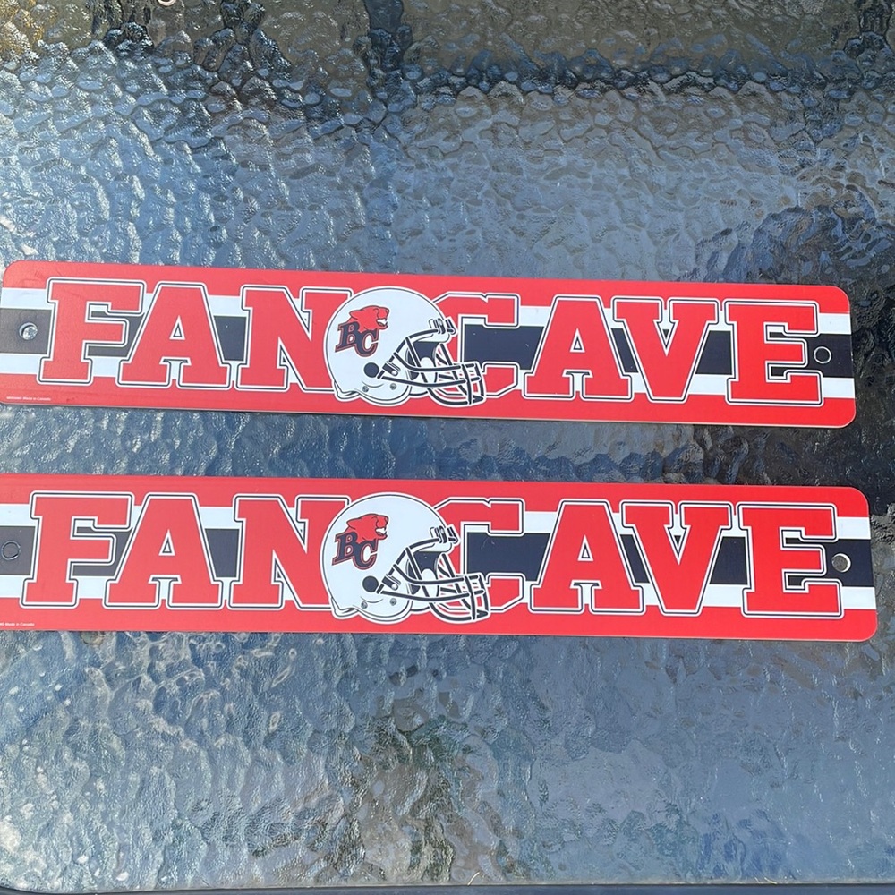 Pair of cfl bc lions fan cave signs